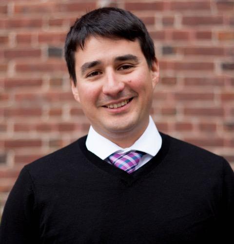 Jesus Barajas smiling wearing a black vest