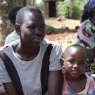 Photo of women and children in Sub-Saharan Africa sitting on the ground